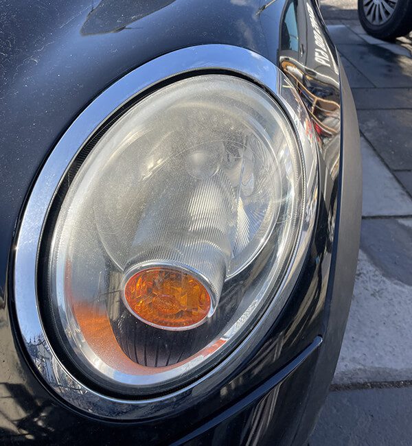 classic car headlight before repair