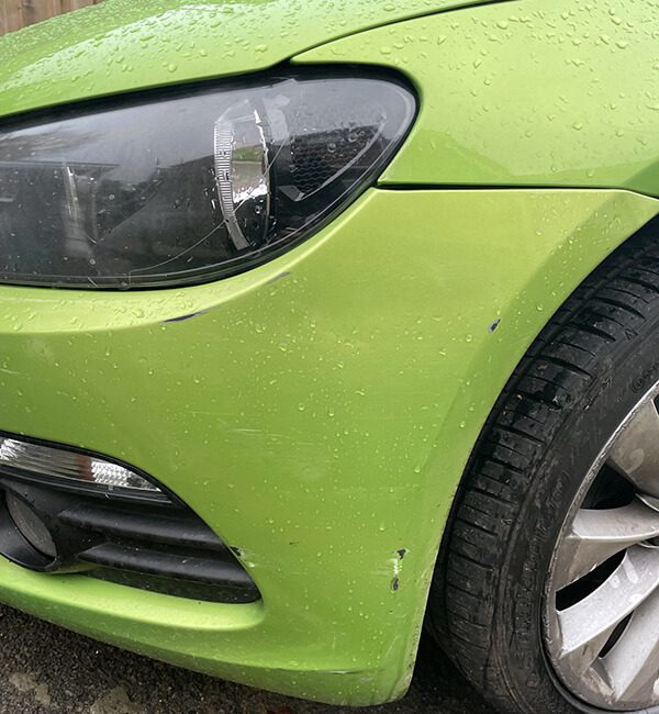 green car before repair